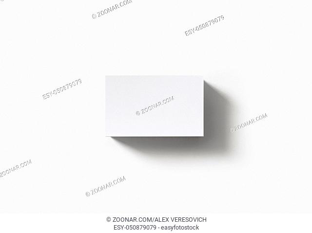 Stack of blank business cards on white paper background. Flat lay