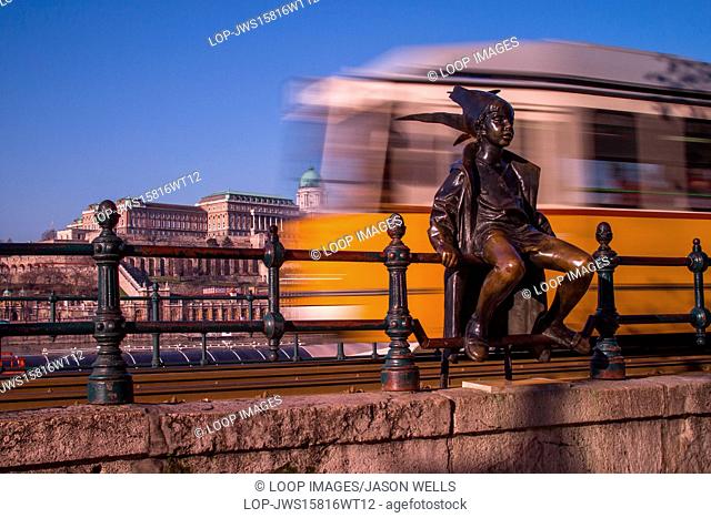 Tram passing the Princess statue in Budapest