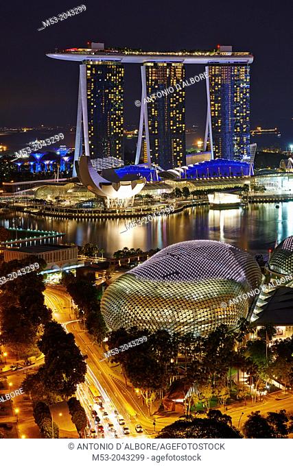 Aerial view of Marina Bay at night. In foreground The Esplanade theatre while in the background the tall towers of Marina Bay Sands. Singapore