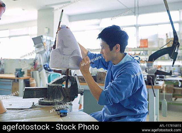Japanese prosthetist working in his studio