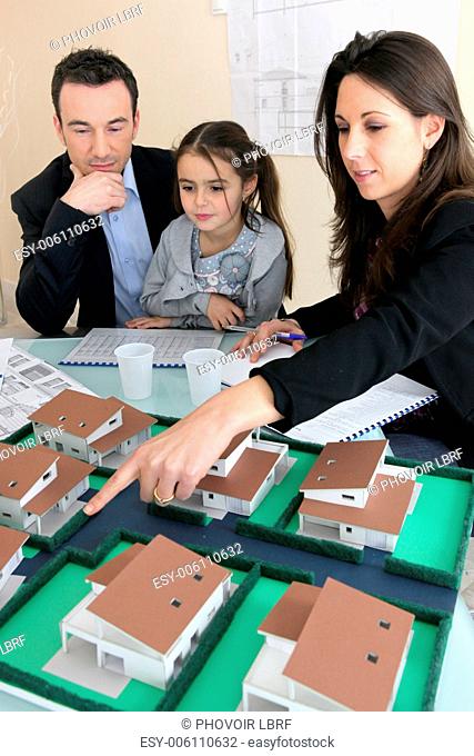 Parents showing daughter new house plans