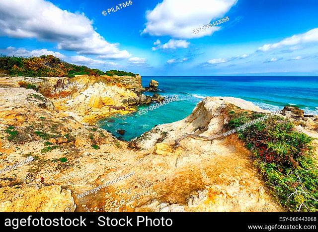 Picturesque seascape with white rocky cliffs, sea bay, islets and faraglioni near by Conca Specchiulla Beach, Salento Adriatic sea coast, Puglia, Italy