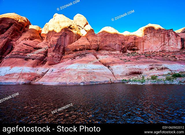 The Colorado River and Antelope Canyon. Grandiose cliffs - red sandstone outcroppings. Tour on a tourist boat on an artificial reservoir Lake Powell
