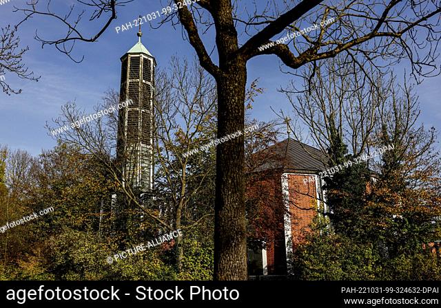 PRODUCTION - 30 October 2022, Hamburg: The sun shines on the church of the former convent of the Carmelite nuns in Finkenwerder