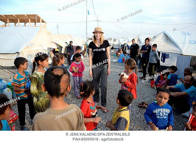 EXCLUSIVE - UNICEF ambassador Eva Padberg is surrounded by children in the Debaga refugee camp between Mosul and Erbil, Iraq, 18 October 2016