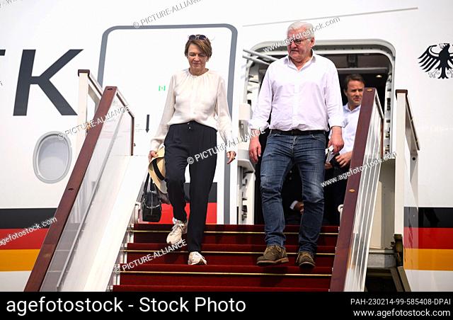 14 February 2023, Cambodia, Siemreab: German President Frank-Walter Steinmeier and his wife Elke Büdenbender arrive at Siem Reap International Airport and walk...