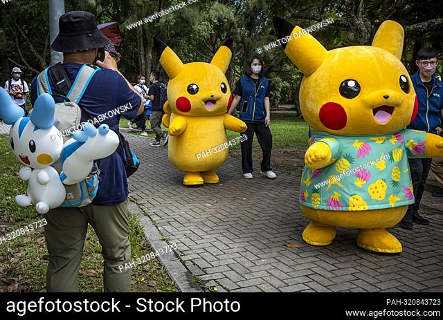 Two Pikachu mascots walk through the park as Pokemon hunters gathered at Da’an Forest Park in Taipei, Taiwan during Pokémon GO Safari Zone on 21/10/2022 by...