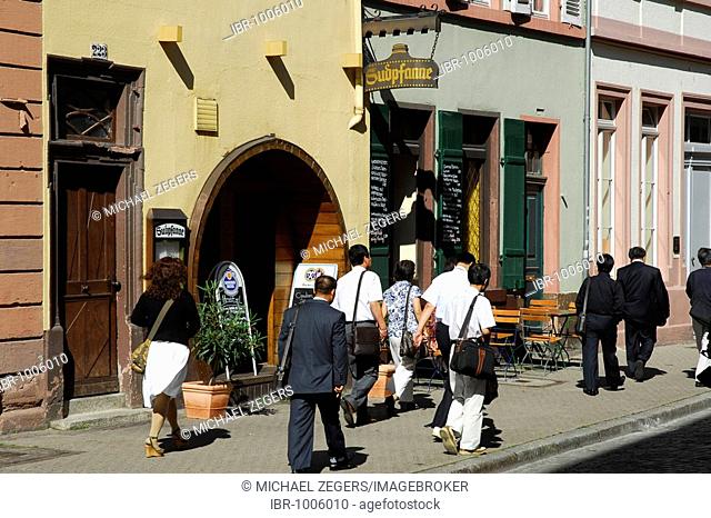 Sudpfanne Restaurant Hostel, tourists passing the entrance, facade and terrace, historic center of Heidelberg, Neckar Valley, Baden-Wuerttemberg, Germany