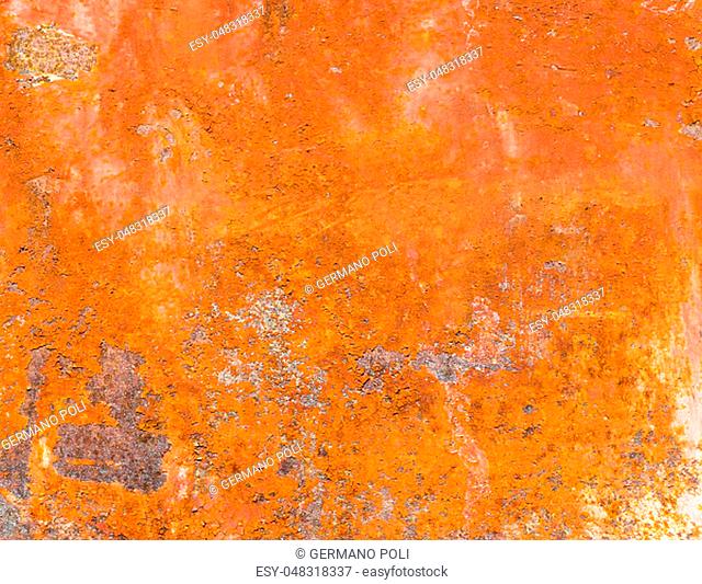 Rusted metal plate with peeling paint. Severe metal corrosion. Grungy texture. Background series