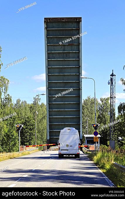 Raised lift bridge with a van waiting at Strömma canal. Strömma canal is situated on the border of the municipalities of Kimitoön and Salo, Finland