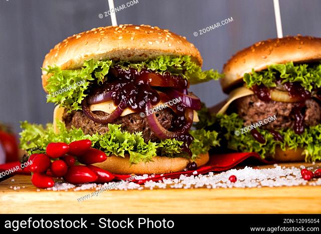 Fast food hamburge, wooden desk background