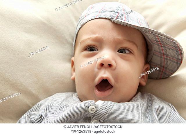 Studio shot of baby boy wearing hat