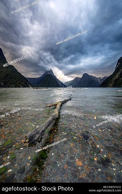 New Zealand, Fiordland, Storm clouds over scenic coastline of Milford Sound