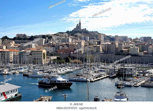 Europe, France, Provence-Alpes-Cote d'Azur, Marseille, old harbour, yachts, behind it Notre-Dame Basilica de la Garde