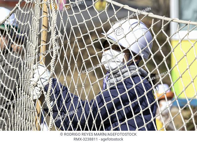 February 22, 2019, Tokyo, Japan - A zookeeper holds up a net during an Escaped Animal Drill at Tama Zoological Park. The annual escape drill is held to train...