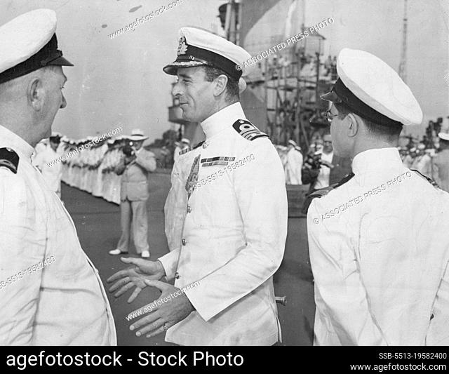 Lord Louis Mountbatten, who is Commander-in-Chief of the Commandos. This picture shows him as Captain of HMS Illustrious a British aircraft-carrier