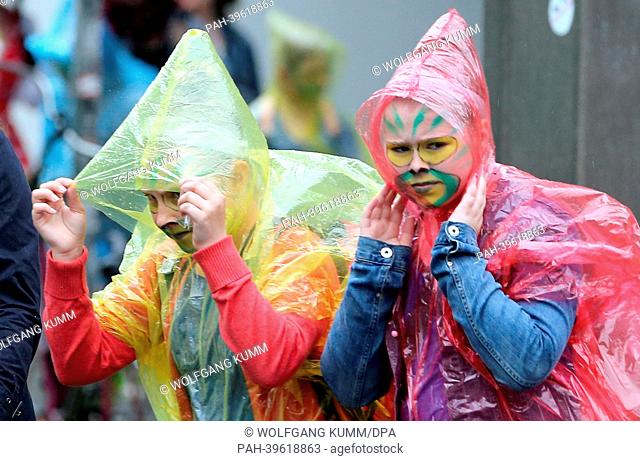 A parade of the 17th Children's Carnival of Cultures leads through streets of Berlin by rainy weather at temperatures around 17 degrees Celsius, Germany