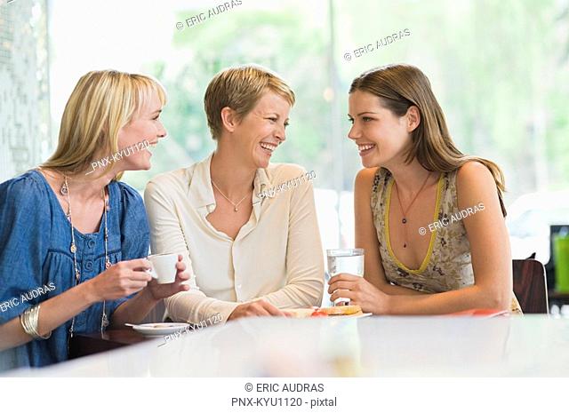 Three women sitting in a restaurant