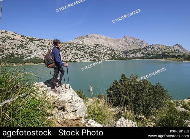 lonely hiker watching the Puig Major, 1436 mts, Cuber Reservoir, Fornalutx, Majorca, Balearic Islands, Spain