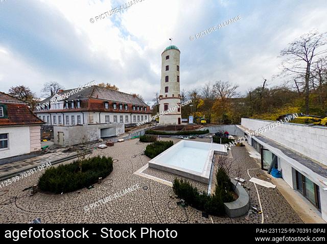 PRODUCTION - 24 November 2023, Hesse, Bad Nauheim: The sauna garden shortly before completion. The historic ""Waitz Tower"" and the ""Balneological Institute""...