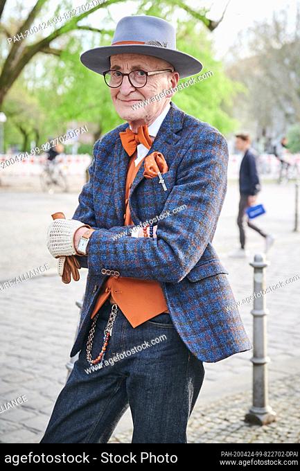16 April 2020, Berlin: Male model and hipster grandpa Günther Anton Krabbenhöft is standing at the Admiralbrücke in Kreuzberg