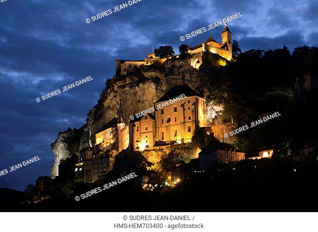 France, Lot, Rocamadour, the hilltop village and the city and its religious shrines dominated by the castle, night view