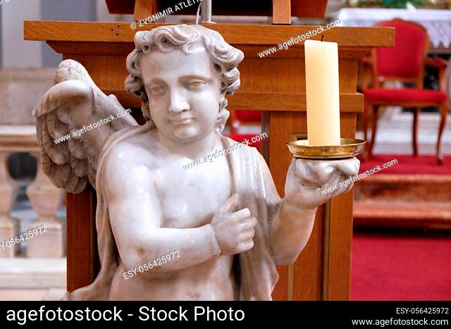 Angel on the altar in Franciscan church of the Friars Minor in Dubrovnik, Croatia