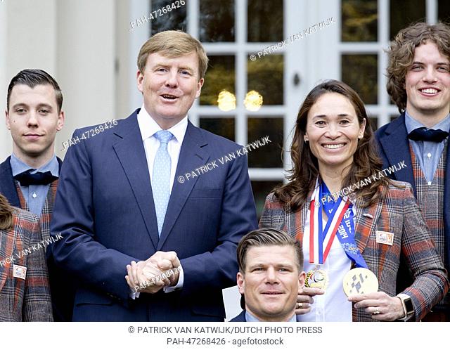 Dutch King Willem-Alexander (C), receives Dutch participants of the Paralympic Games 2014 in Sochi, Bibian Mentel (Gold, Snowboard, 2nd R)