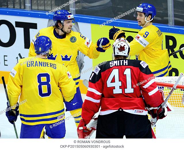Anton Lander (SWE, second from left, celebrates with his teammates Petter Granberg, left, and Filip Forsberg, right, the first goal as goalkeeper Mike Smith...