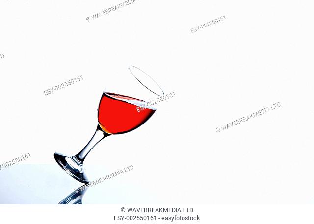Glass falling against a white background