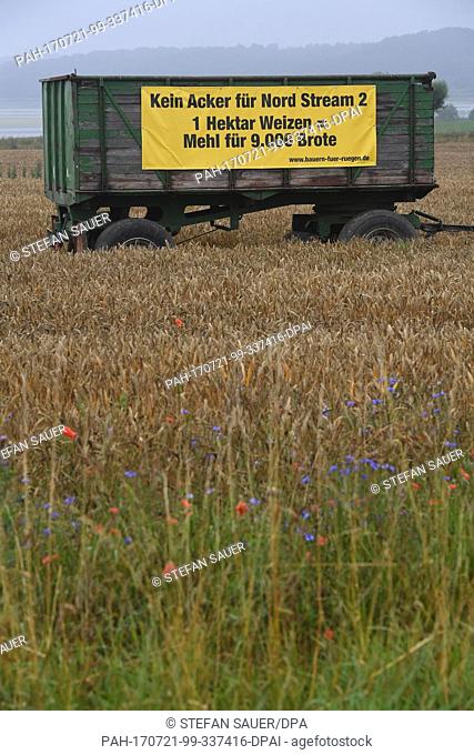 A banner with the slogan 'Not an acre for Nord Stream 2' (German: 'Kein Acker fuer Nord Stream 2') hangs from an agricultural trailer in Putbus on the Baltic...