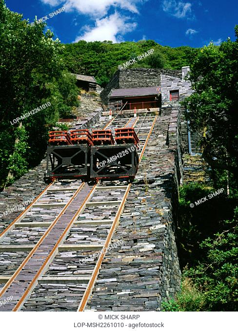 Wales, Gwynedd, Llanberis. Slate wagons, rails, cables and roller house on the restored V2 Incline of the Vivian Quarry. Finished slates were moved on inclined...