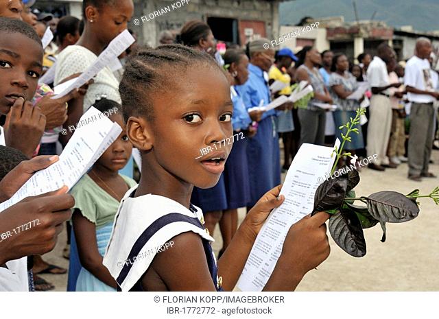 Girl during a church service for the victims of the earthquake in January 2010, Fort National district, Port-au-Prince, Haiti, Caribbean, Central America