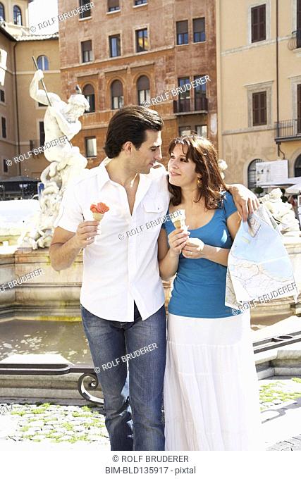 Caucasian couple with map at Piazza Novona, Rome, Italy