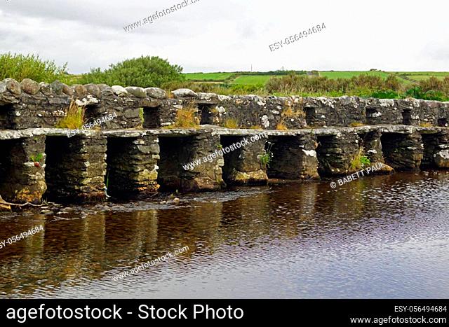 The Clapper Bridge of Bunlahinch is located about ten kilometers west of Louisburgh in County Mayo in Ireland
