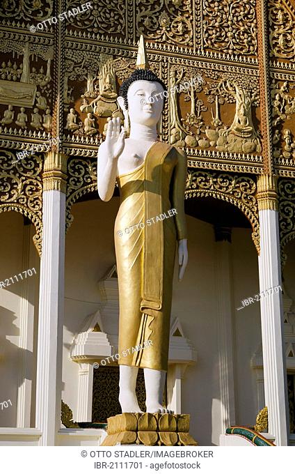 Buddha statue in front of Wat That Luang Neua temple, Vientiane, Laos, Indochina, Asia