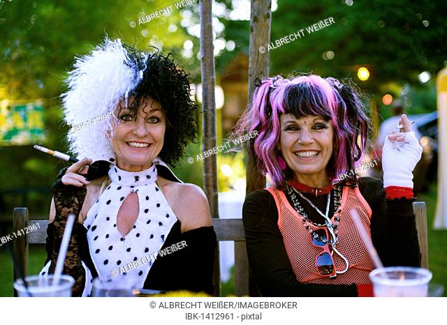 Two women are dressed up as Nina Hagen and Glenn Close as the witch Cruella DeVil