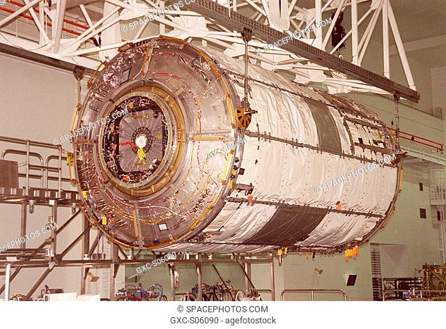 06/26/2000 -- This closeup shows the U.S. Lab Destiny being lifted by an overhead crane to move it to a weigh stand. A component of the International Space...