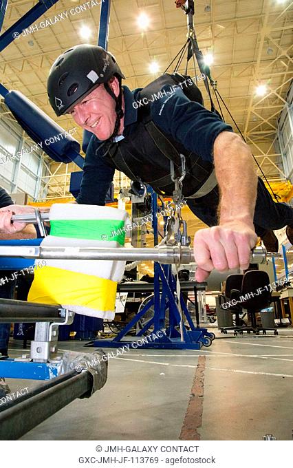 European Space Agency astronaut Timothy Peake participates in an extravehicular activity (EVA) pistol grip tool (PGT) training session using the Active Response...