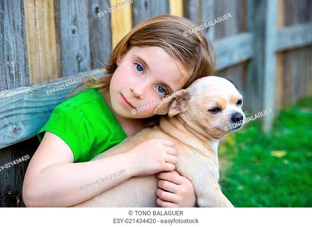 Blond happy girl with her chihuahua doggy portrait