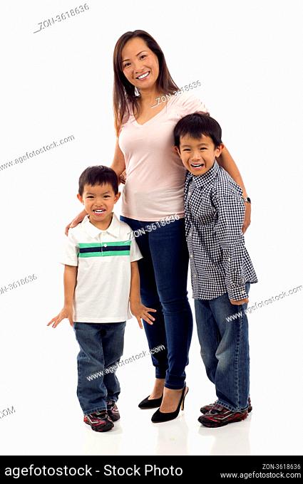 Happy Family, Full length of a happy Asian mother with her two playful kids isolated over white background