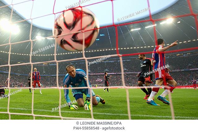 Munich's Robert Lewandowski scores a 6-0 goal past Hamburg's goalkeeper Jaroslav Drobny at the German Bundesliga soccer match between FC Bayern Munich and...