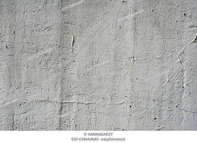 Texture of old rustic wall covered with gray stucco