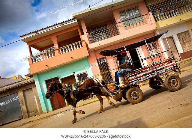 Horse and cart in a colourful street in Trinidad, Cuba