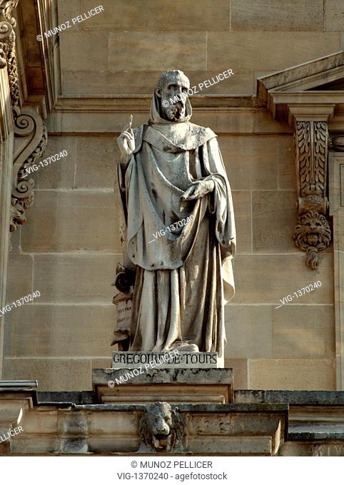FRANCE, PARIS, 01.05.2007, Statue of Saint Gregory of TOURS, Bishop of Tours at the facade of The Louvre Museum - Palais Royal. Paris. France