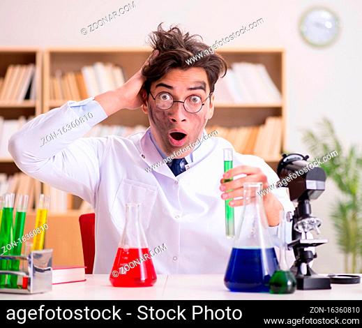 The mad crazy scientist doctor doing experiments in a laboratory