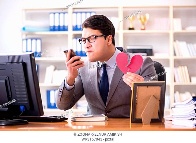 Businessman in saint valentine concept in office