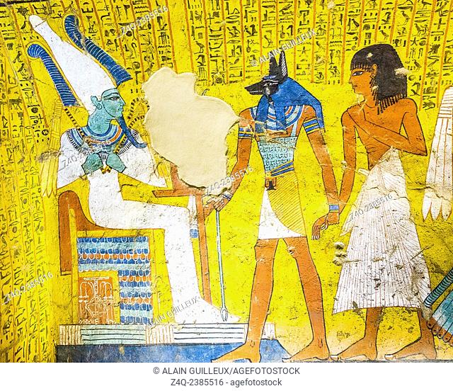 UNESCO World Heritage, Thebes in Egypt, Deir el Medineh, tomb of Irynefer. The god Anubis leads the Dead to god Osiris. Osiris seats on a throne