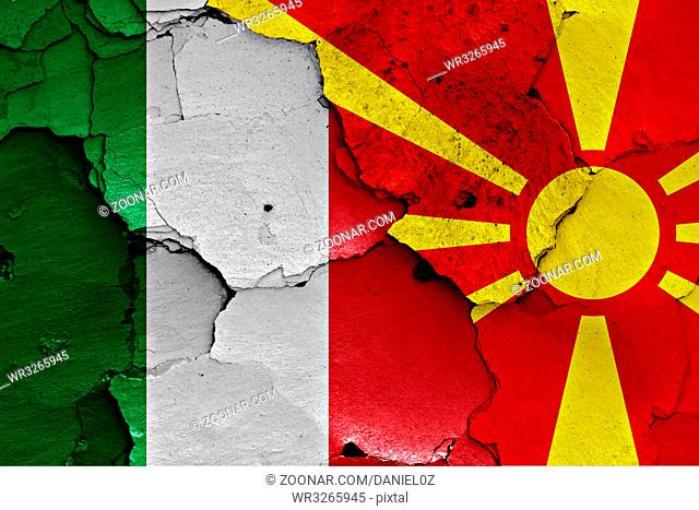 flags of Italy and Macedonia painted on cracked wall