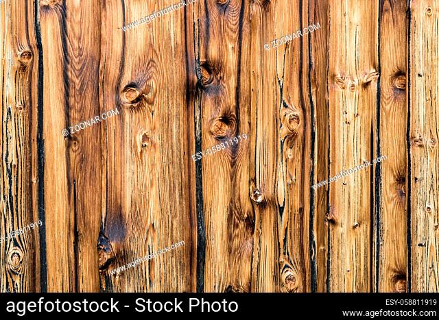 Natural brown barn wood wall. Wall texture background pattern. Wood planks, boards are old with a beautiful rustic and burned look, style